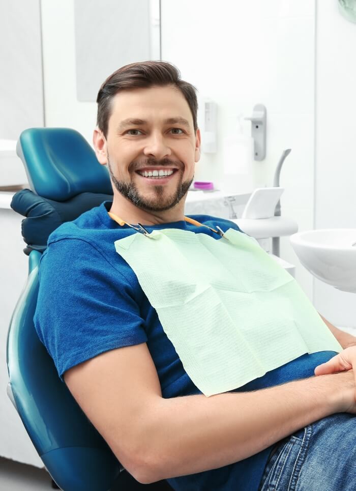 Man smiling after emergency dentistry
