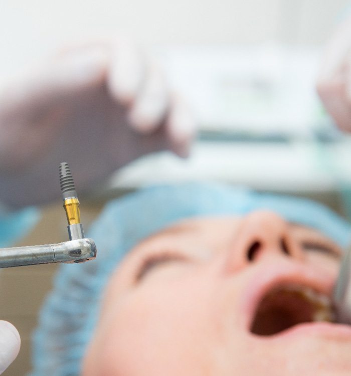 A patient undergoing dental implant surgery