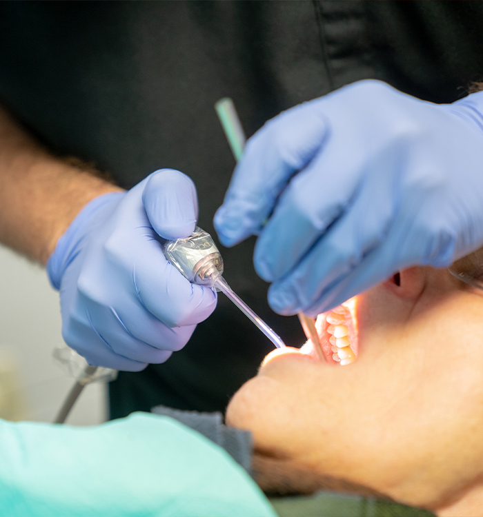 Dentist treating dental patient