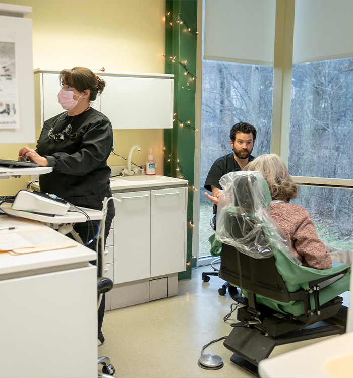 Dentist talking to dental patient