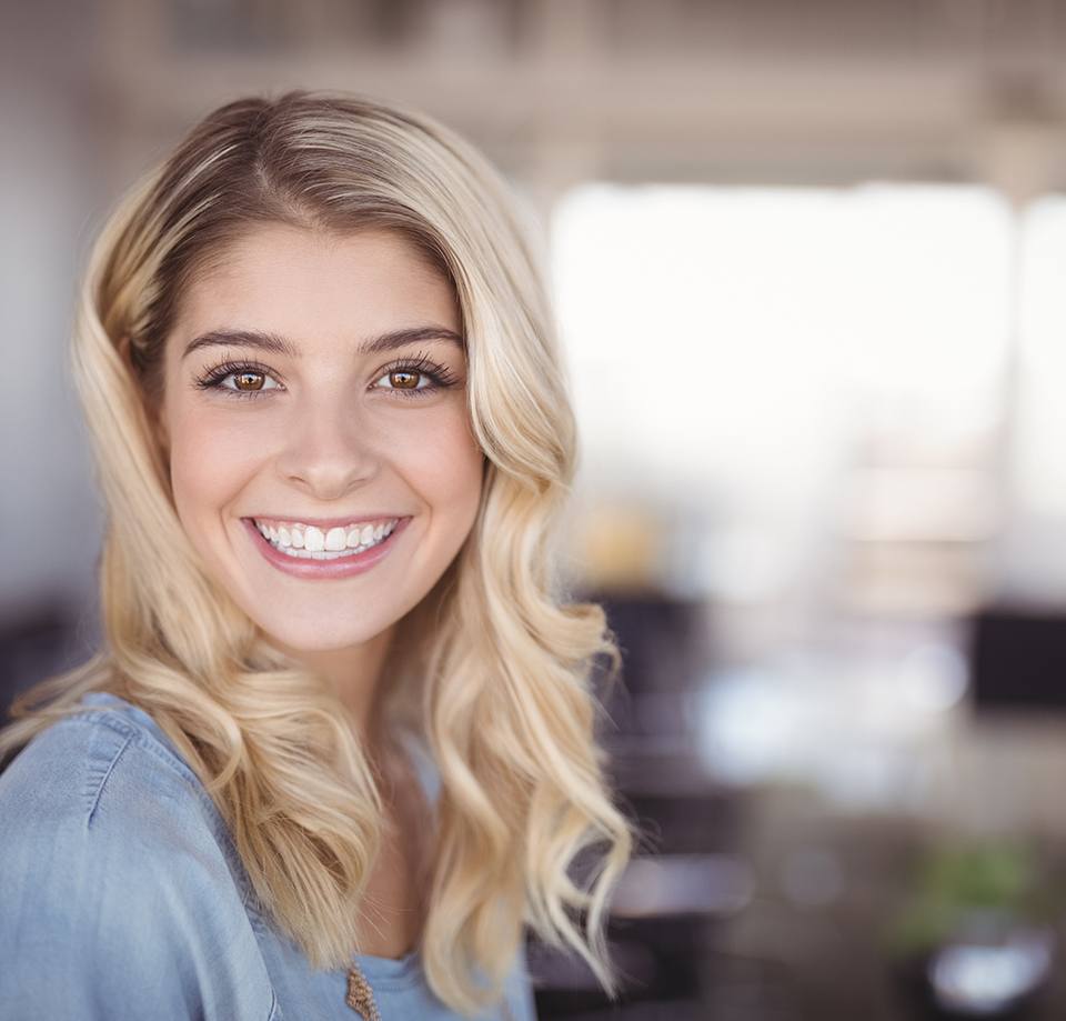 woman smiling after cosmetic dentistry