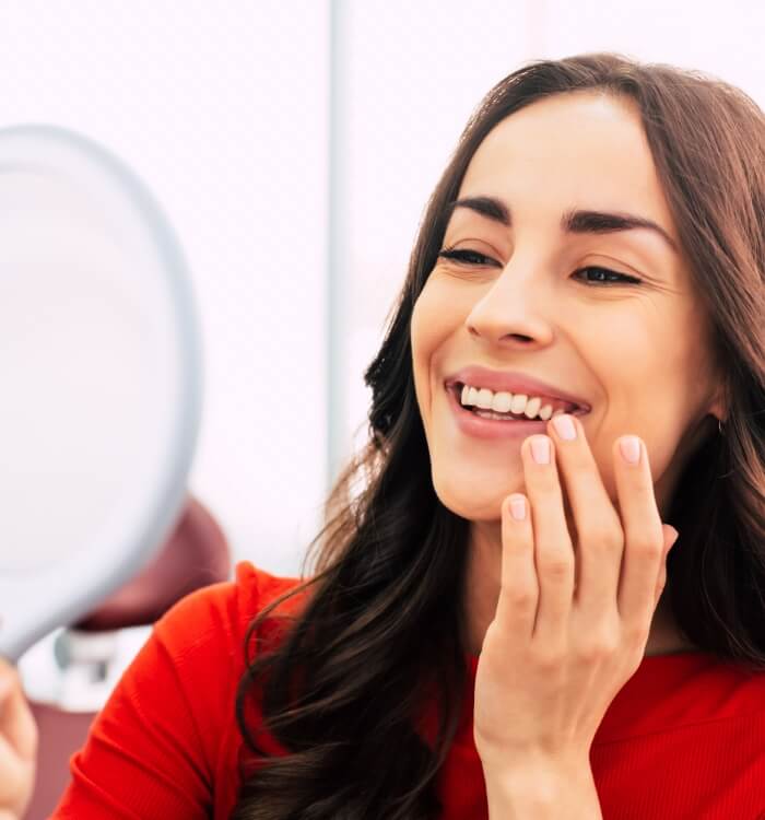 Woman with dental implants smiling