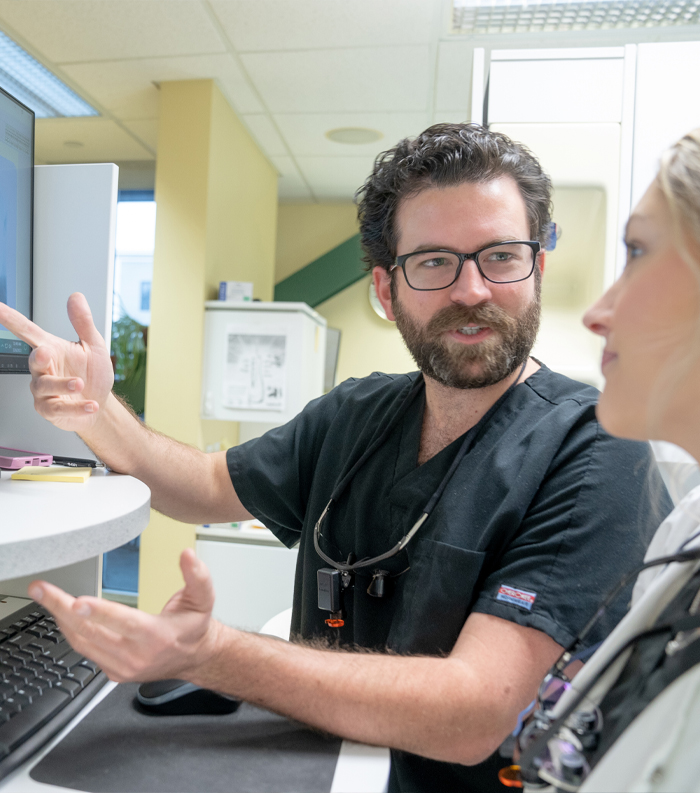 Dentist in Montpelier Vermont talking to dental patient