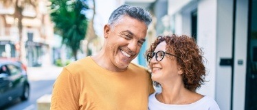 Man and woman smiling outdoors