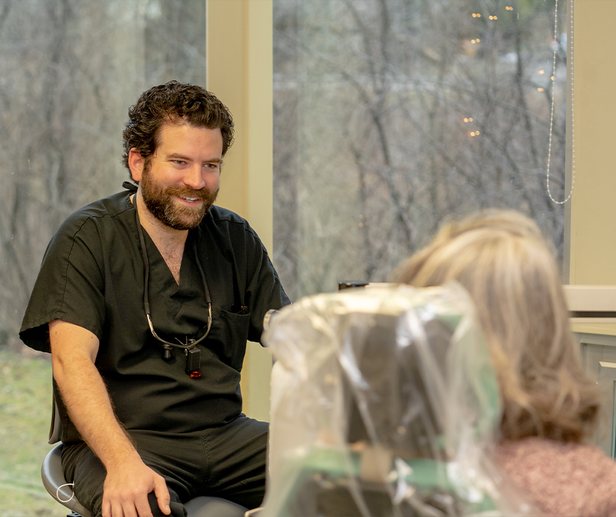 Doctor Hale talking to dental patient