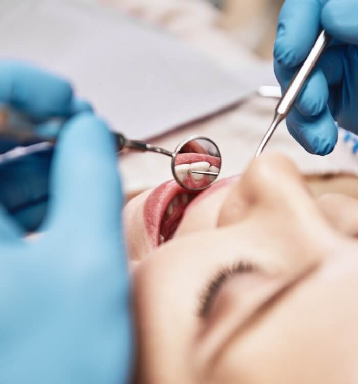 Dental patient receiving an oral cancer screening