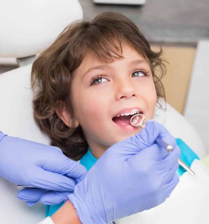 Child receiving children's dentistry treatment
