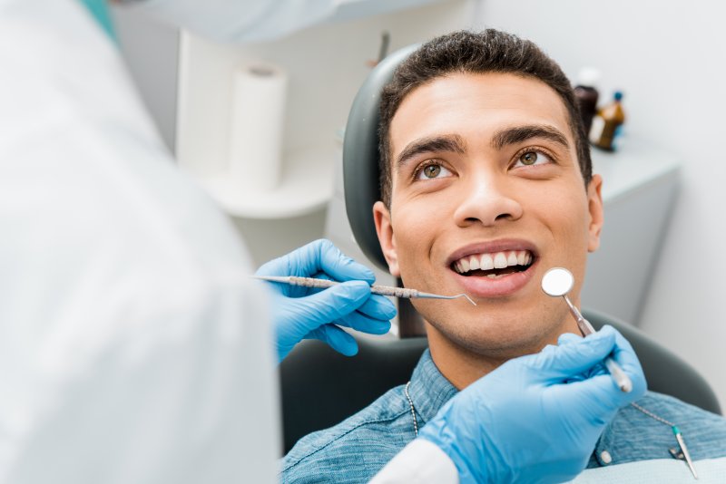 man undergoing a dental checkup