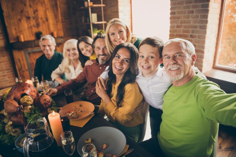 A family enjoying Thanksgiving with good oral health