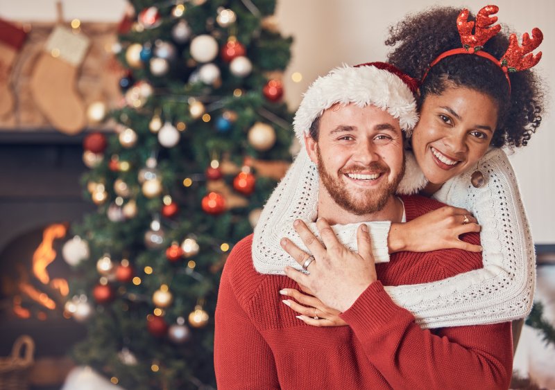 A happy couple smiling during the holidays